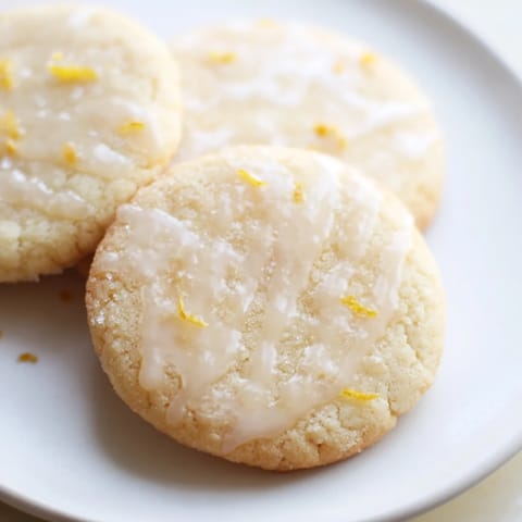 Deliciously buttery Lemon Sugar Cookies, rolled in sugar, ready for a delightful bite.