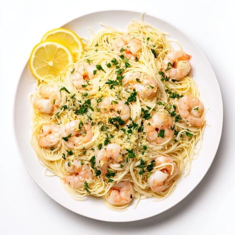 Tender shrimp tossed with al dente angel hair in a zesty lemon-butter sauce, served with lemon wedges.