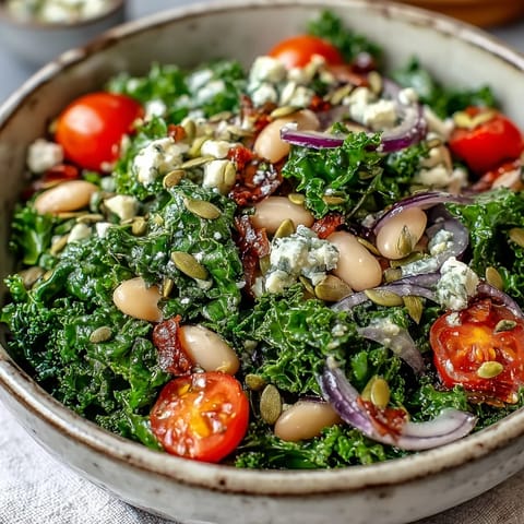 Hearty White Bean and Kale Salad served with optional feta and ripe cherry tomatoes.