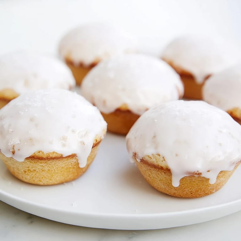 Golden-brown muffin tin donuts, easily made at home, offer a delightful bakery-style treat.