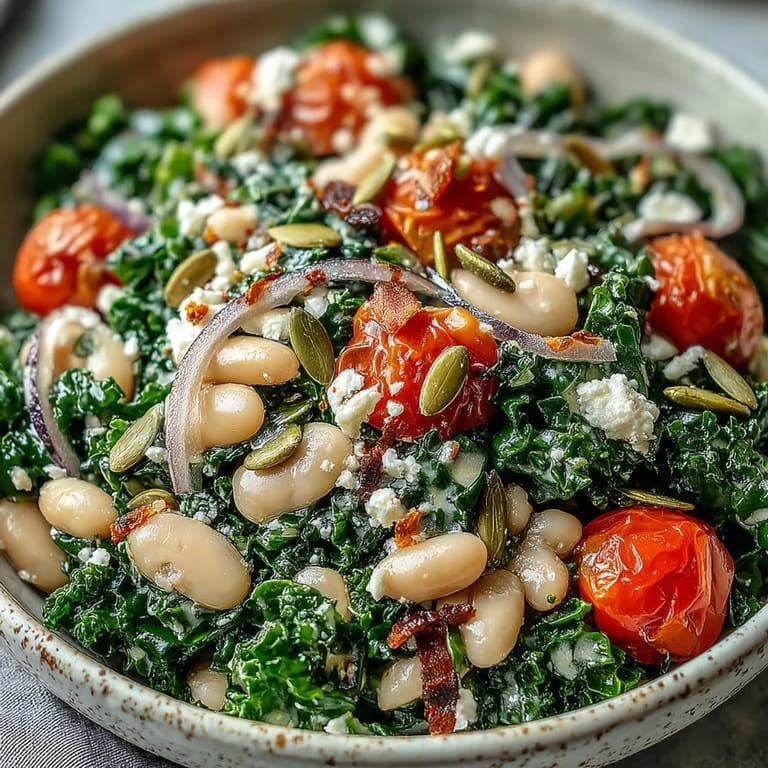 A vibrant White Bean and Kale Salad tossed with sunflower seeds and a tangy dressing.